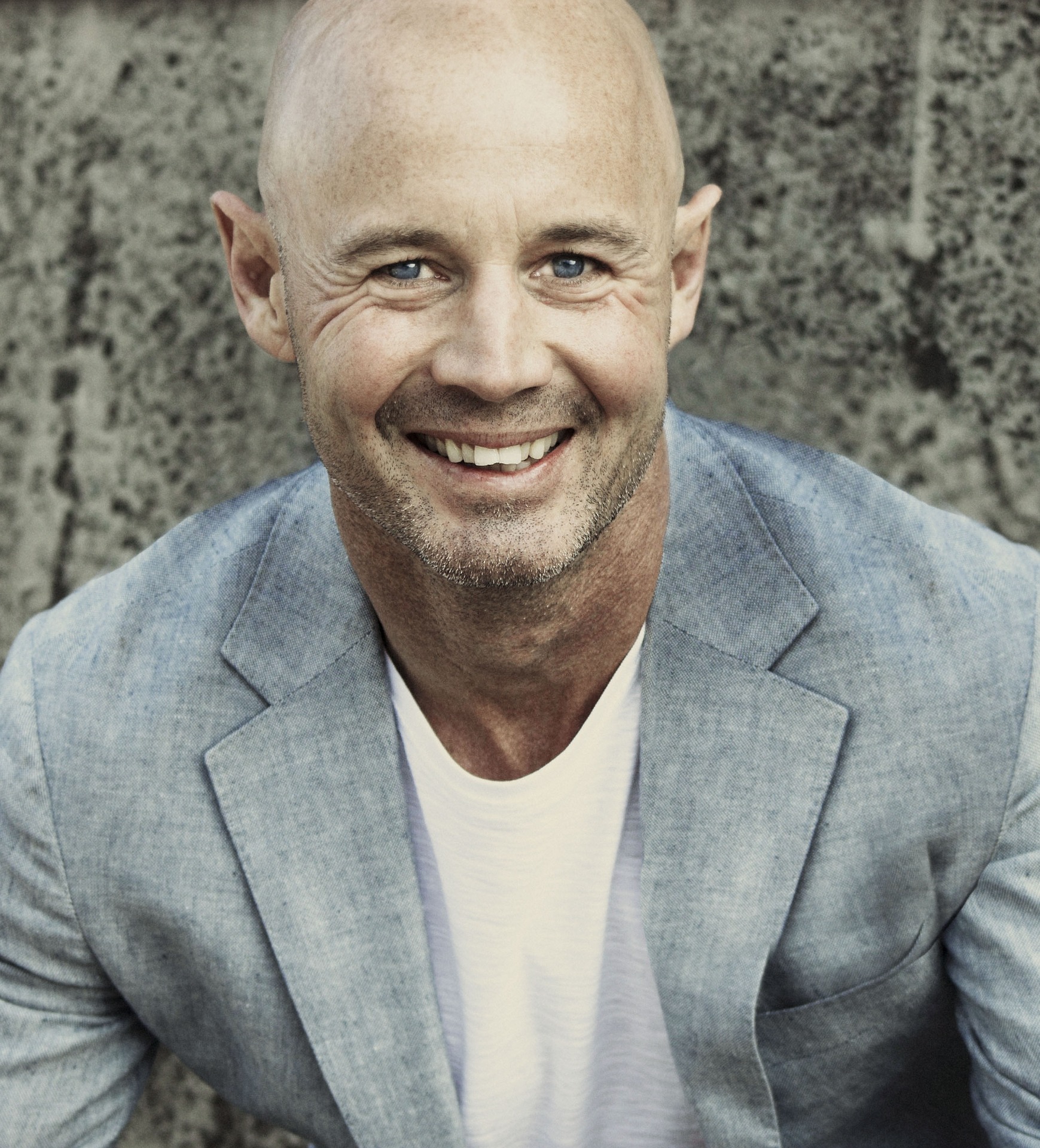 middle-aged bald man smiling